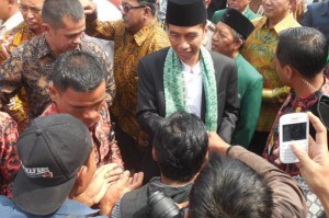 Presiden Jokowi saat menghadiri Muktamar ke-19 sekaligus Peringatan 100 Tahun Mathlaul Anwar, di Pandeglang, Banten, Sabtu (8/8)